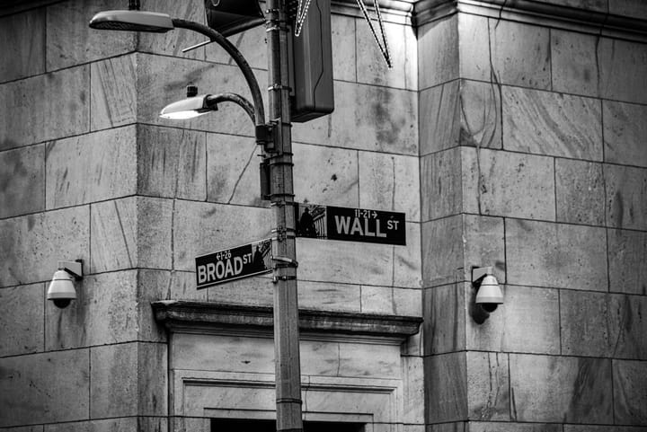 A Wall Street skyline with digital overlays, symbolizing the intersection of finance and technology in the Anthropic mythos.