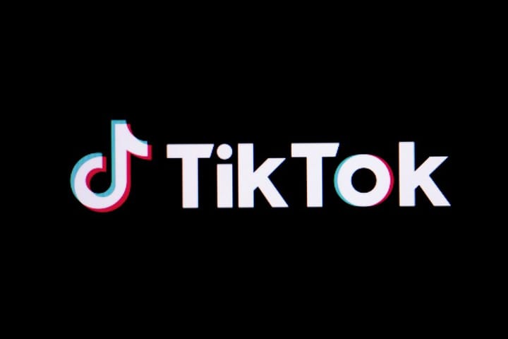 A vibrant TikTok interface showcasing travel destinations, featuring trending videos and user-generated content inspiring wanderlust.